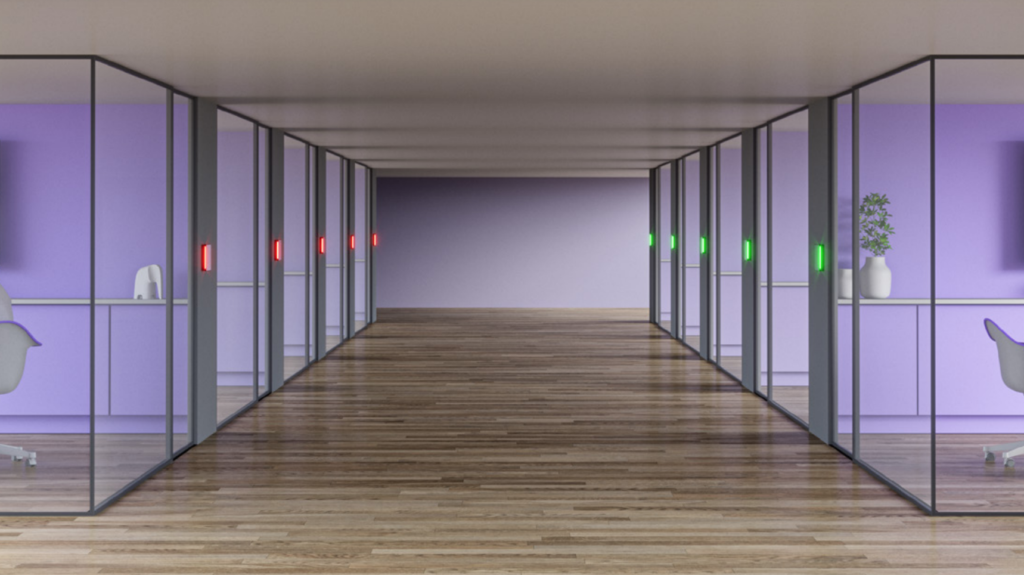 Picture of hallway with several meeting rooms lit up in red and green
