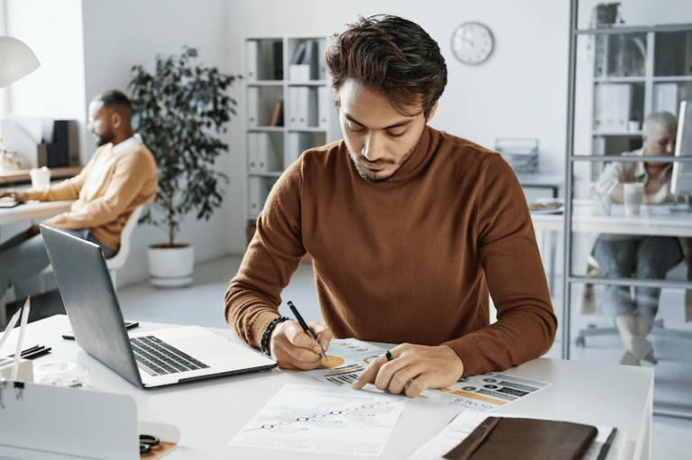 Young man concentrating in an open office setting